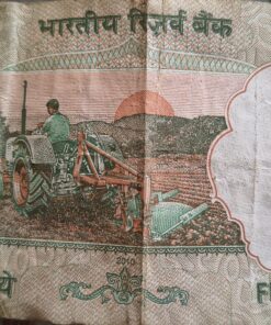 5 rs notes featuring tractor on one side and mahatma gandhi on another