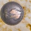 Antique 1895 Queen Victoria One Penny coin from Great Britain made of bronze/copper, featuring the portrait of Queen Victoria on one side and Britannia seated with a trident on the reverse. Original vintage Victorian-era collectible coin showing natural wear, patina, and signs of circulation consistent with age. Ideal for coin collectors, numismatists, and historical memorabilia enthusiasts.